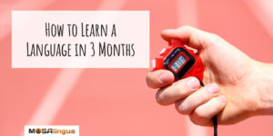 Image of a hand holding a stopwatch with text "How to learn a language in 3 months."