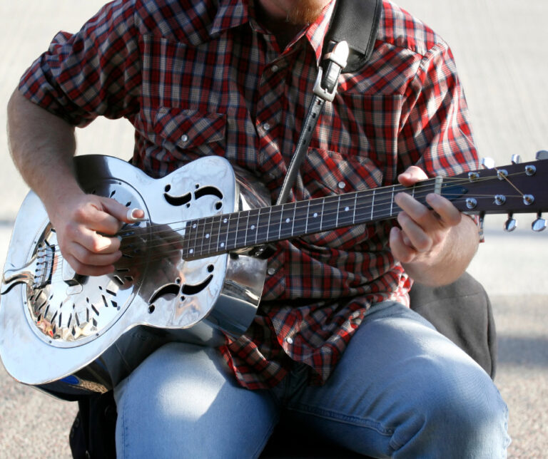 Country musician playing a steel guitar.