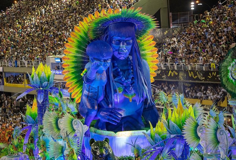 Samba school float at the Rio Carnival in Brazil. The street is packed with spectators.