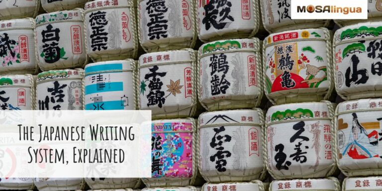 Stacks and rows of colorful sake barrels with Japanese writing on them. Text reads: The Japanese writing system, explained. MosaLingua.