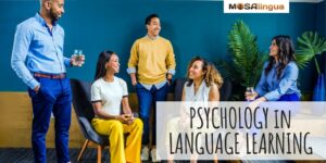 5 young adults dressed professionally and talking in a group. Text reads: Psychology in language learning, MosaLingua