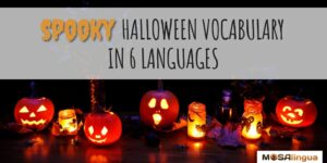 Assortment of lit jack-o-lanterns on a dark background. Text reads: Spooky Halloween vocabulary in 6 languages. MosaLingua.