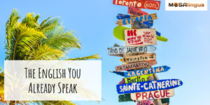 Colorful sign with arrows pointing to various famous cities. text reads: "The English You Already Speak."