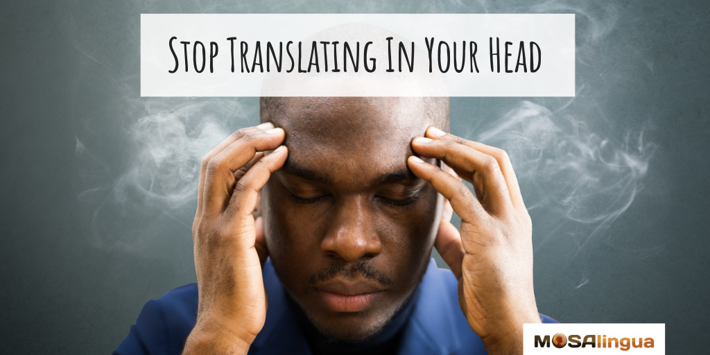 Photograph of a man with smoke coming out of his ears. Text reads "Stop translating in your head."