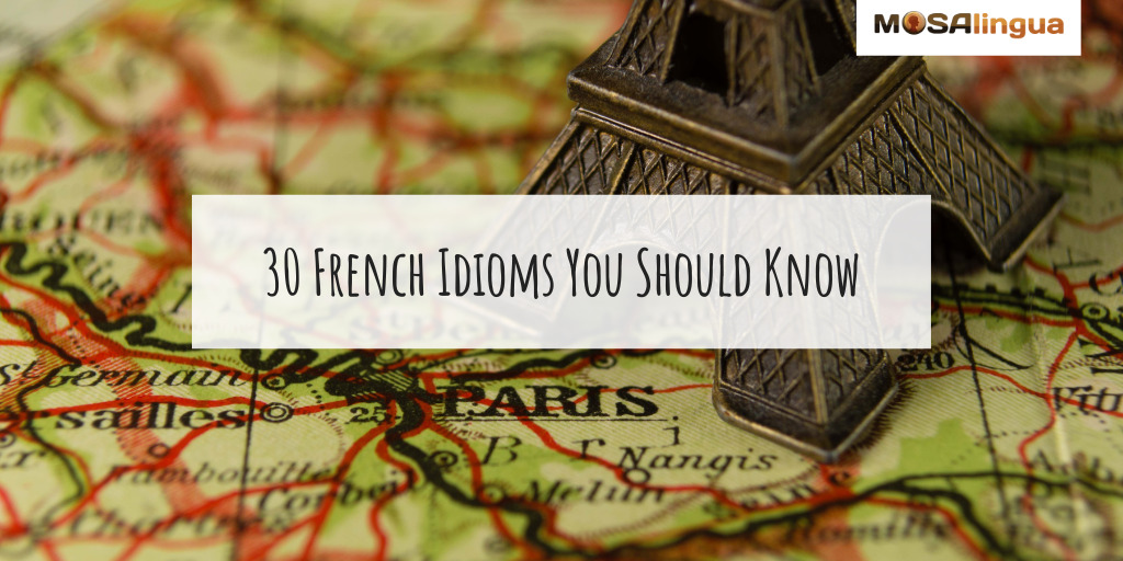 Image of a map of France with an Eiffel Tower figurine sitting on top. Text reads "30 French Idioms You Should Know."