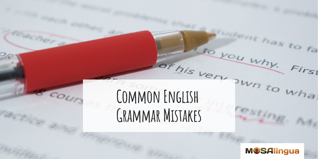 A sheet of paper with corrections written in red pen. Text reads "Common English Grammar Mistakes."
