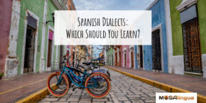 Image of bicycles parked on a colorful street. Text reads "Spanish dialects: Which should you learn?"