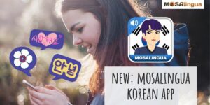 A young woman looks at her phone, which has purple speech bubbles with Korean words coming out of it. The MosaLingua Learn Korean app icon is on screen next to her. Text reads: New MosaLingua Korean app.