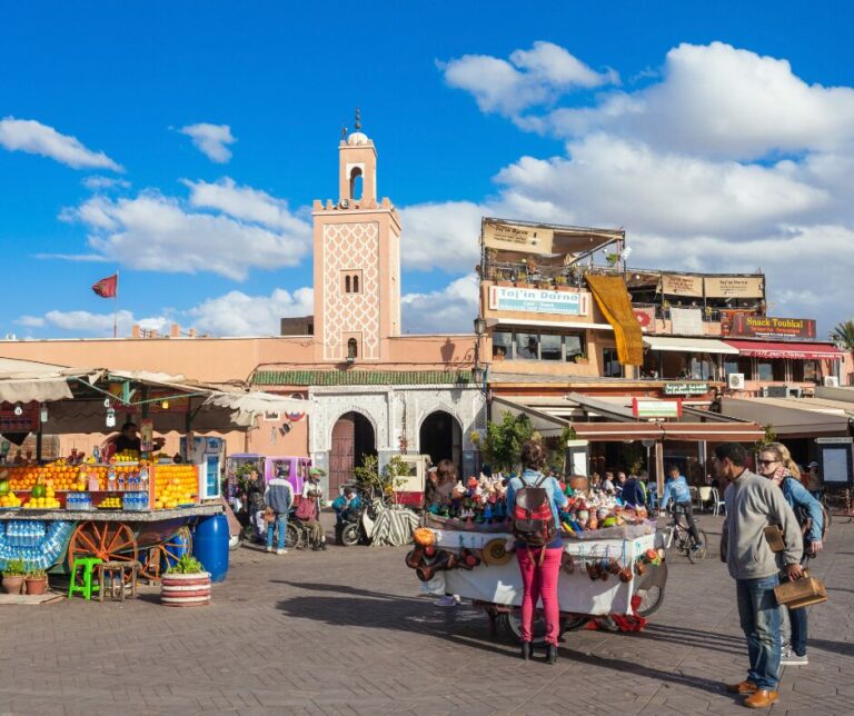 Image of an open market with a minaret in the background. Part of "Useful Arabic Phrases" article. 